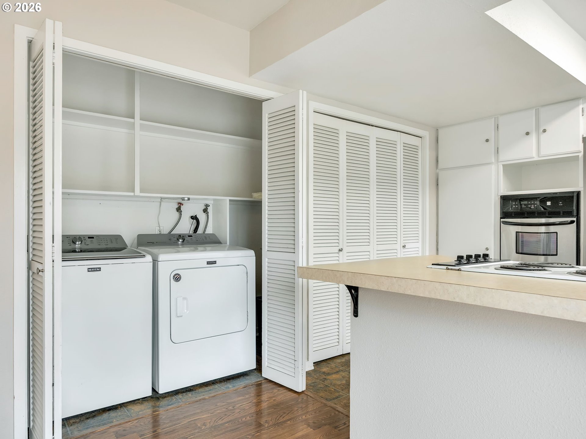 91923 Ridge Road Warrenton, OR 97146 - Photo 11 of 35 a kitchen with appliances cabinets and a counter top space