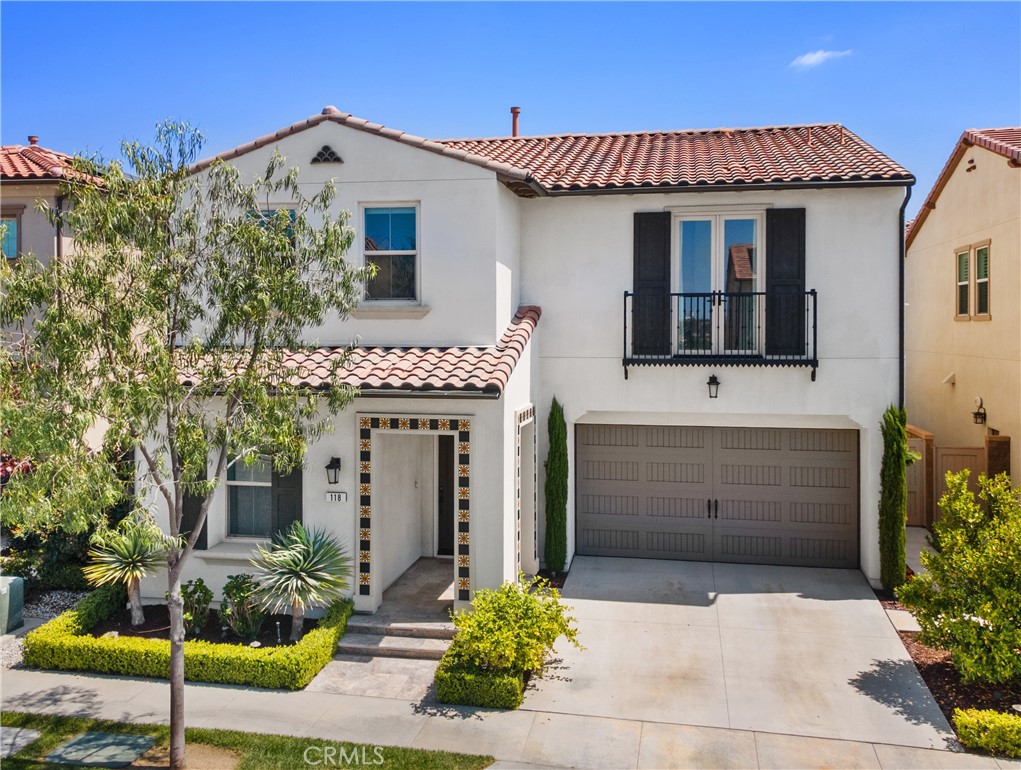 118 Ritual Irvine, CA 92618 - Photo 1 of 1 a front view of a house with potted plants
