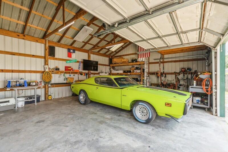 2377 Lake Silver Road Crestview, FL 32536 - Photo 12 of 36 a view of a garage with furniture