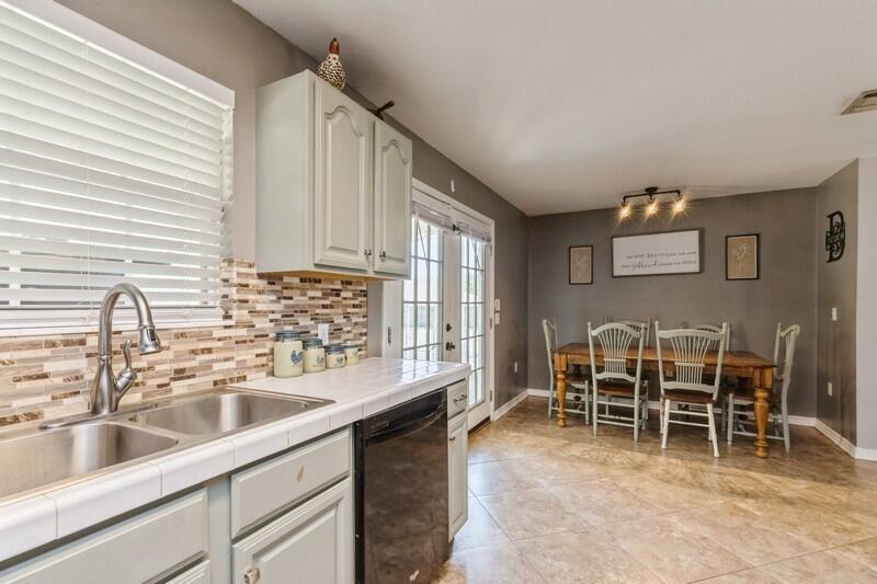 2377 Lake Silver Road Crestview, FL 32536 - Photo 20 of 36 a kitchen with furniture a sink and a window