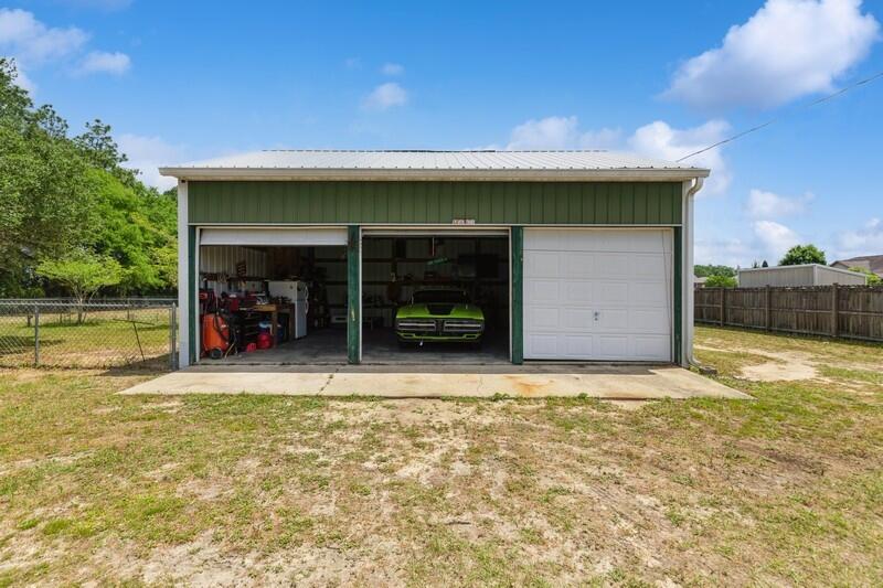 2377 Lake Silver Road Crestview, FL 32536 - Photo 2 of 36 a view of a water heater and a garage