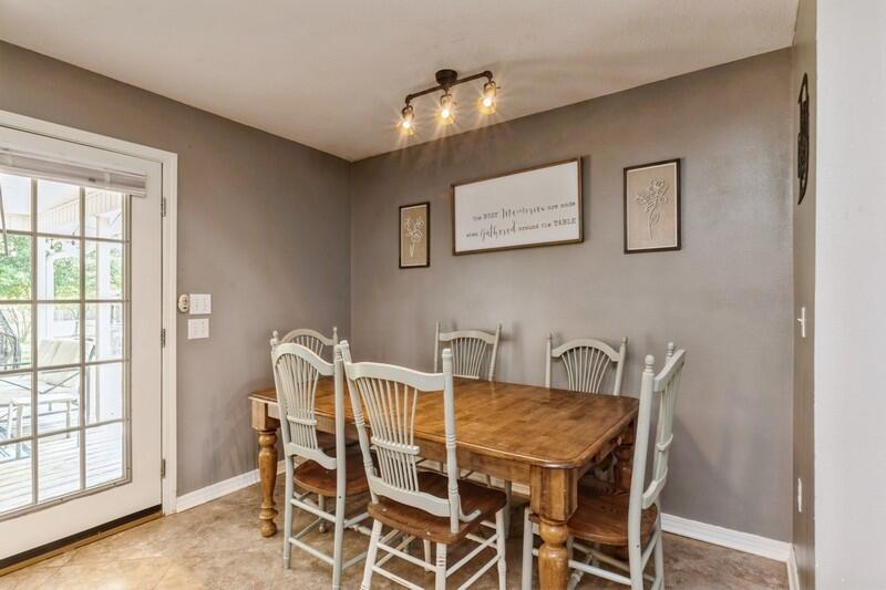 2377 Lake Silver Road Crestview, FL 32536 - Photo 21 of 36 a view of a dining room with furniture and wooden floor