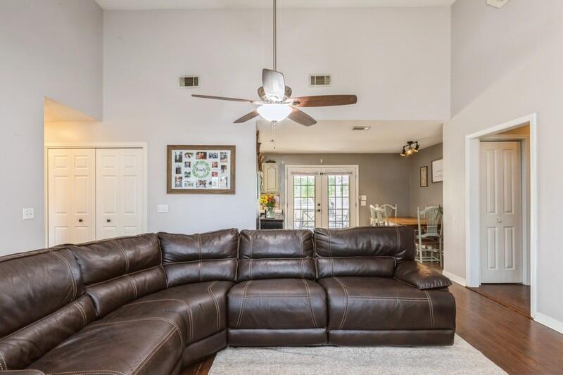 2377 Lake Silver Road Crestview, FL 32536 - Photo 23 of 36 a living room with furniture ceiling fan and a window