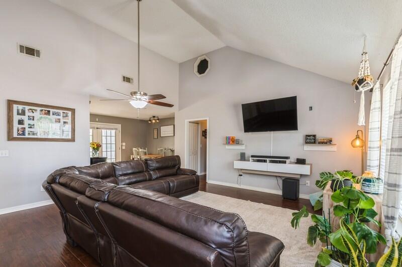 2377 Lake Silver Road Crestview, FL 32536 - Photo 24 of 36 a living room with furniture a flat screen tv and a window