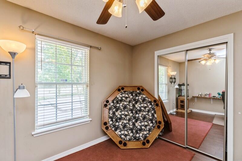 2377 Lake Silver Road Crestview, FL 32536 - Photo 31 of 36 a room with a large bed and a chandelier