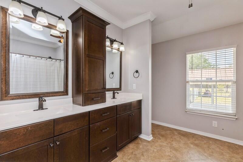2377 Lake Silver Road Crestview, FL 32536 - Photo 32 of 36 a bathroom with a double vanity sink mirror and double
