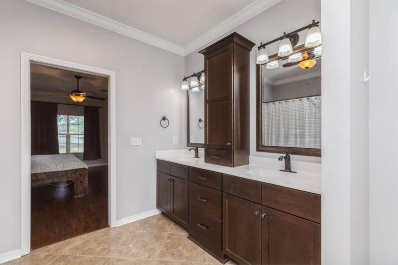 2377 Lake Silver Road Crestview, FL 32536 - Photo 33 of 36 a en suite bathroom with a double vanity sink and mirror