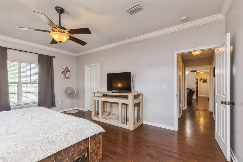 2377 Lake Silver Road Crestview, FL 32536 - Photo 34 of 36 a bedroom with a bed and a flat screen tv