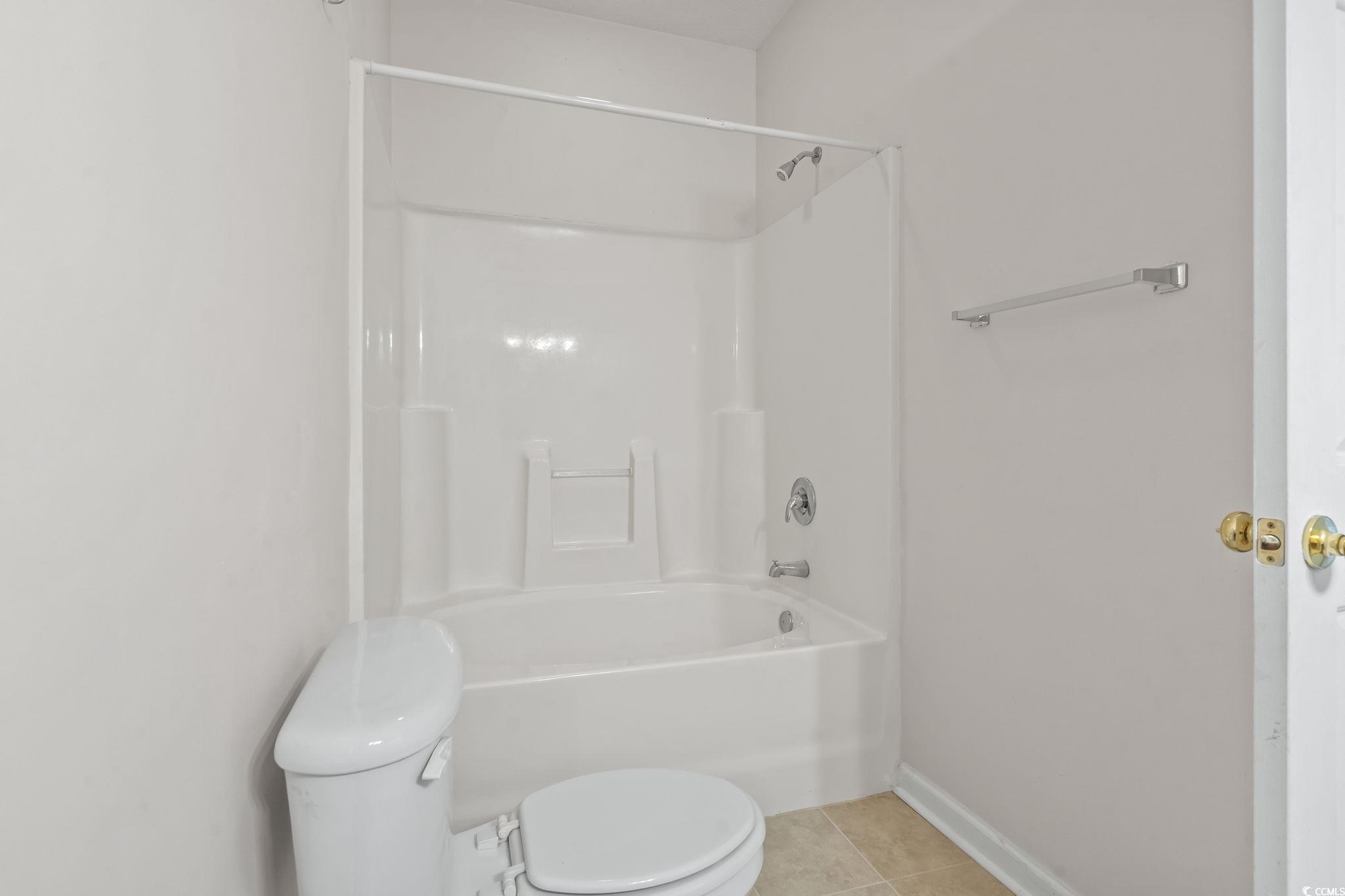 5810 Longwood Drive, Unit 14304 Murrells Inlet, SC 29576 - Photo 11 of 30 Bathroom with tile patterned flooring and shower /