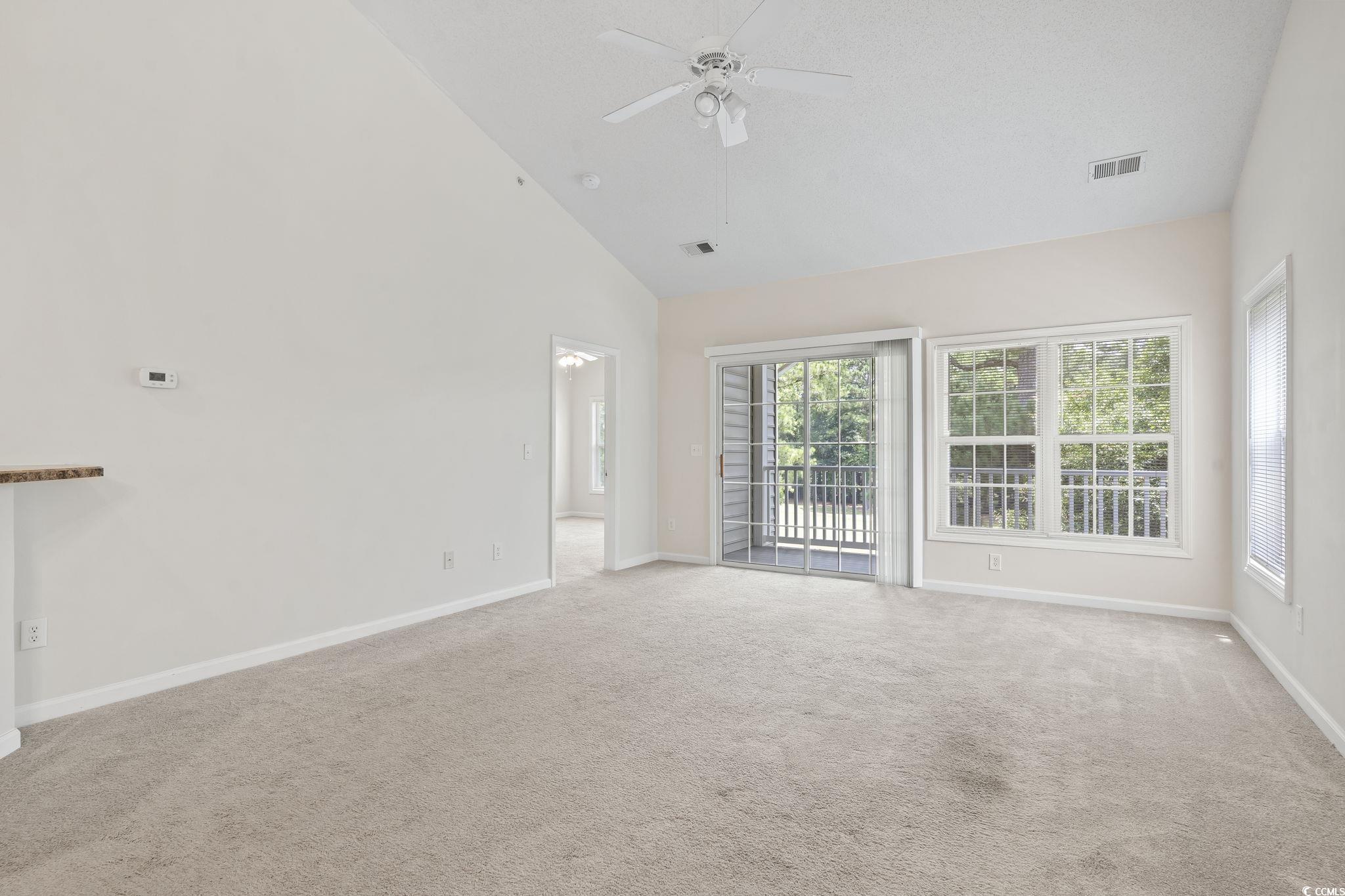 5810 Longwood Drive, Unit 14304 Murrells Inlet, SC 29576 - Photo 21 of 30 Carpeted spare room with plenty of natural light,