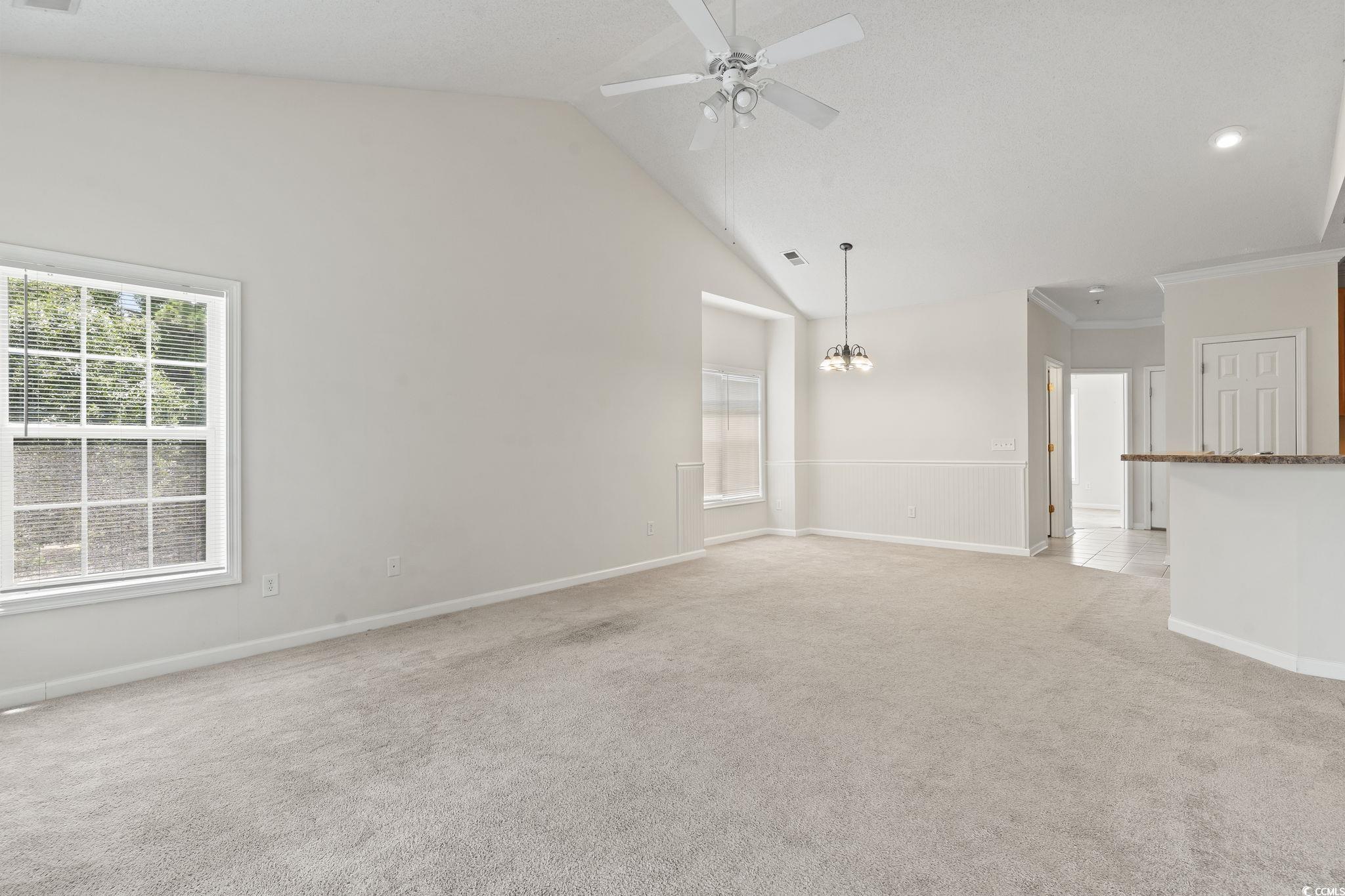 5810 Longwood Drive, Unit 14304 Murrells Inlet, SC 29576 - Photo 23 of 30 Unfurnished living room with light carpet, a ceili