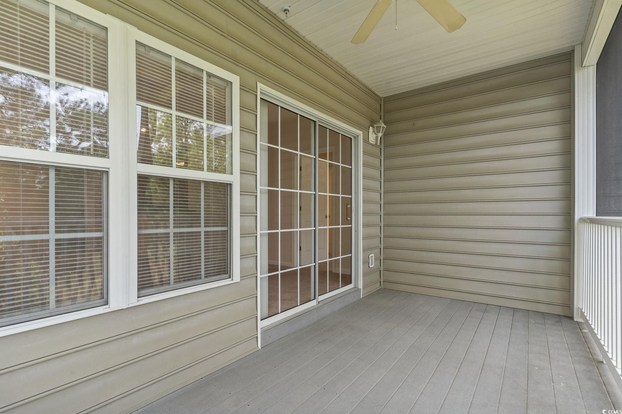5810 Longwood Drive, Unit 14304 Murrells Inlet, SC 29576 - Photo 26 of 30 Unfurnished sunroom featuring ceiling fan