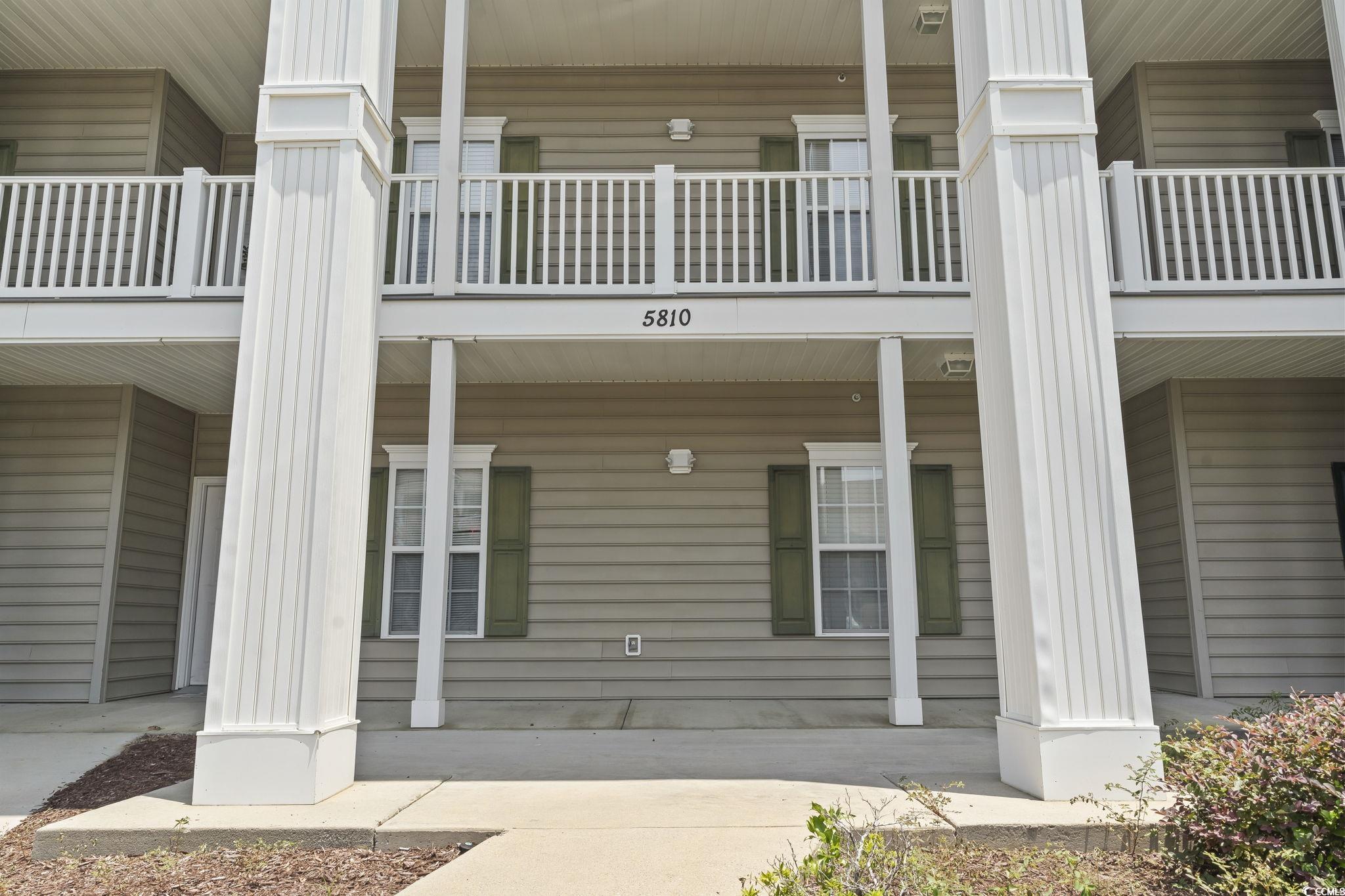 5810 Longwood Drive, Unit 14304 Murrells Inlet, SC 29576 - Photo 29 of 30 Exterior space featuring a balcony and covered por
