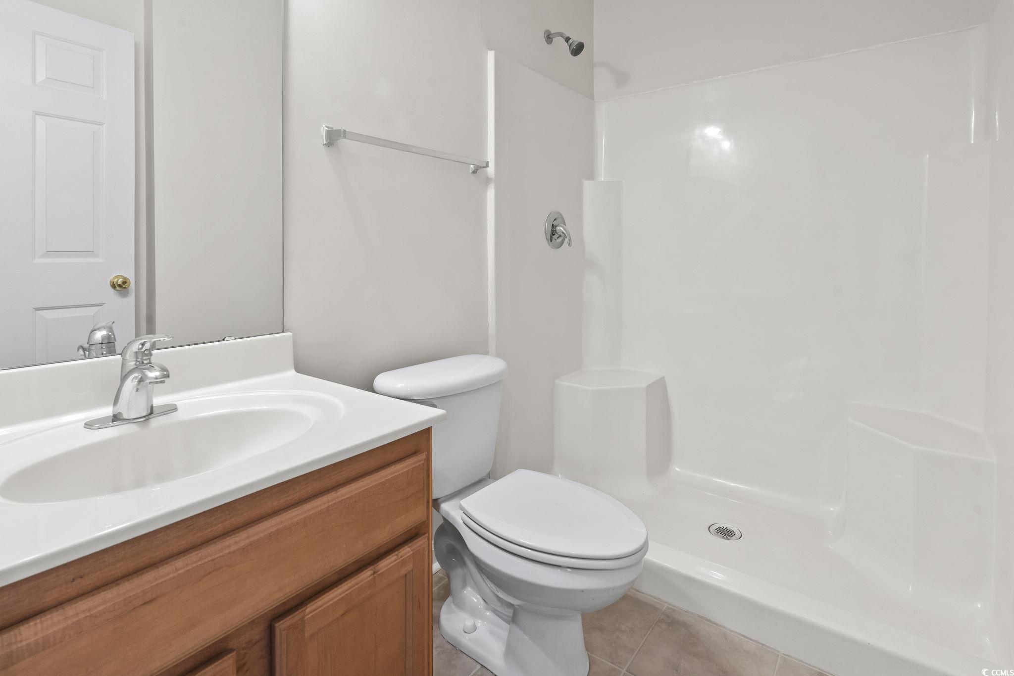 5810 Longwood Drive, Unit 14304 Murrells Inlet, SC 29576 - Photo 8 of 30 Full bathroom with tile patterned flooring, vanity