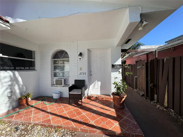 a outdoor space with patio furniture and a fireplace