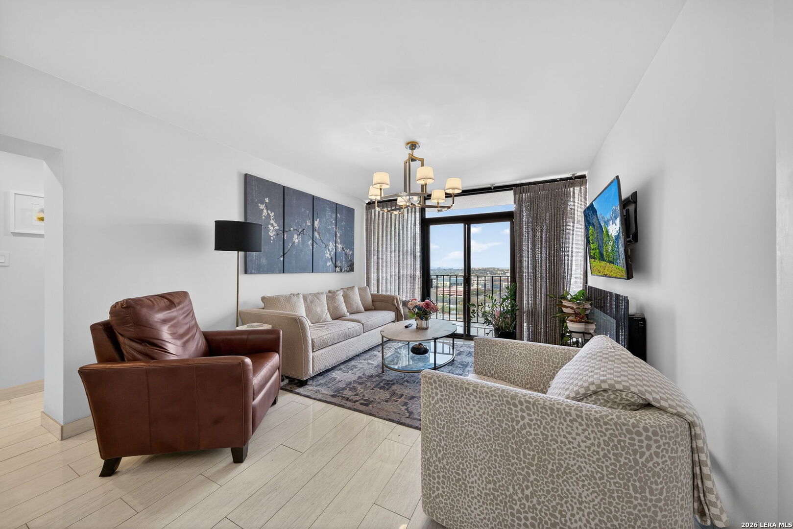 a living room with furniture and a flat screen tv