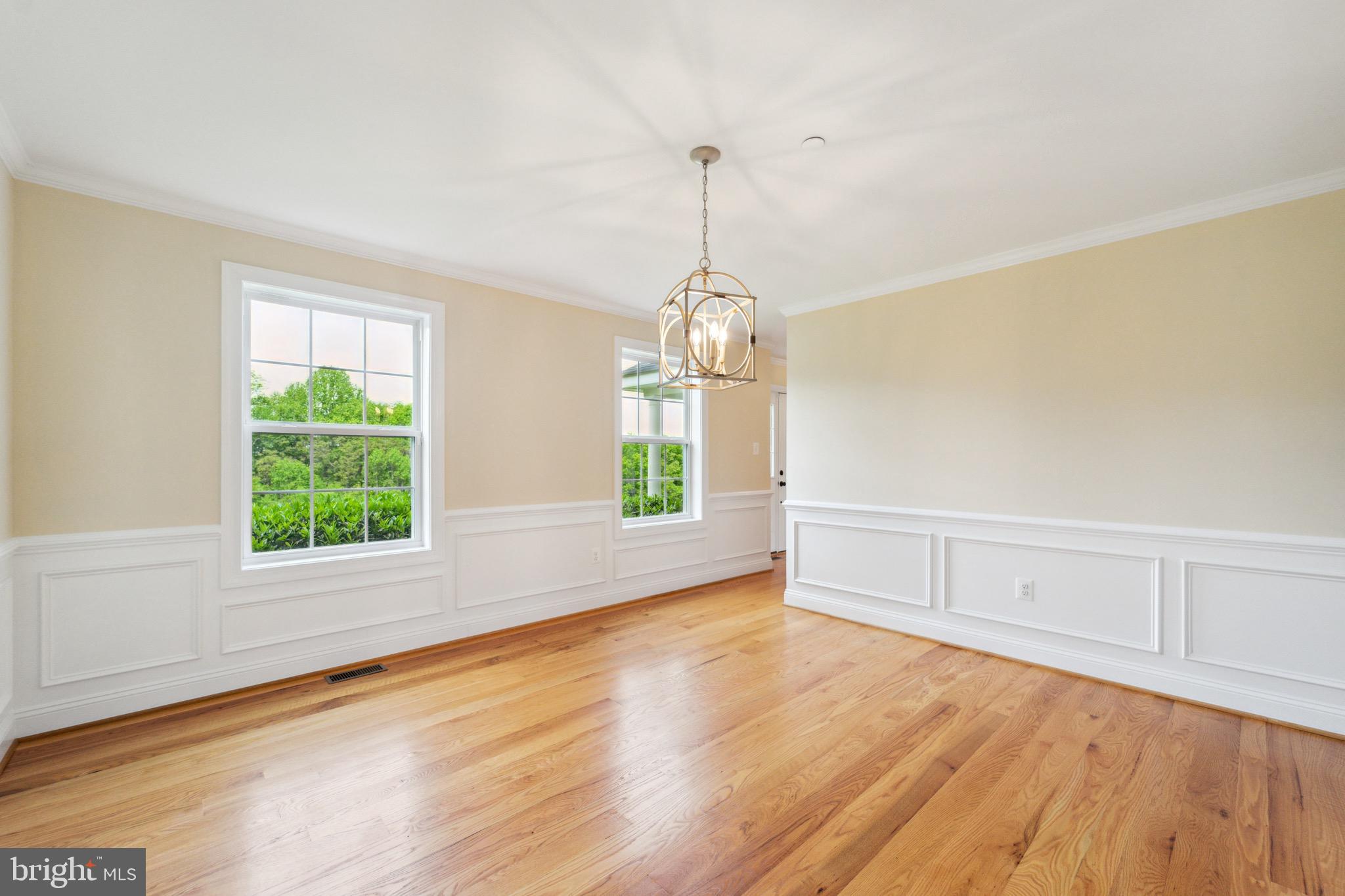 4905 Bartholows Road Mount Airy, MD 21771 - Photo 16 of 70 a view of an empty room with wooden floor and a window