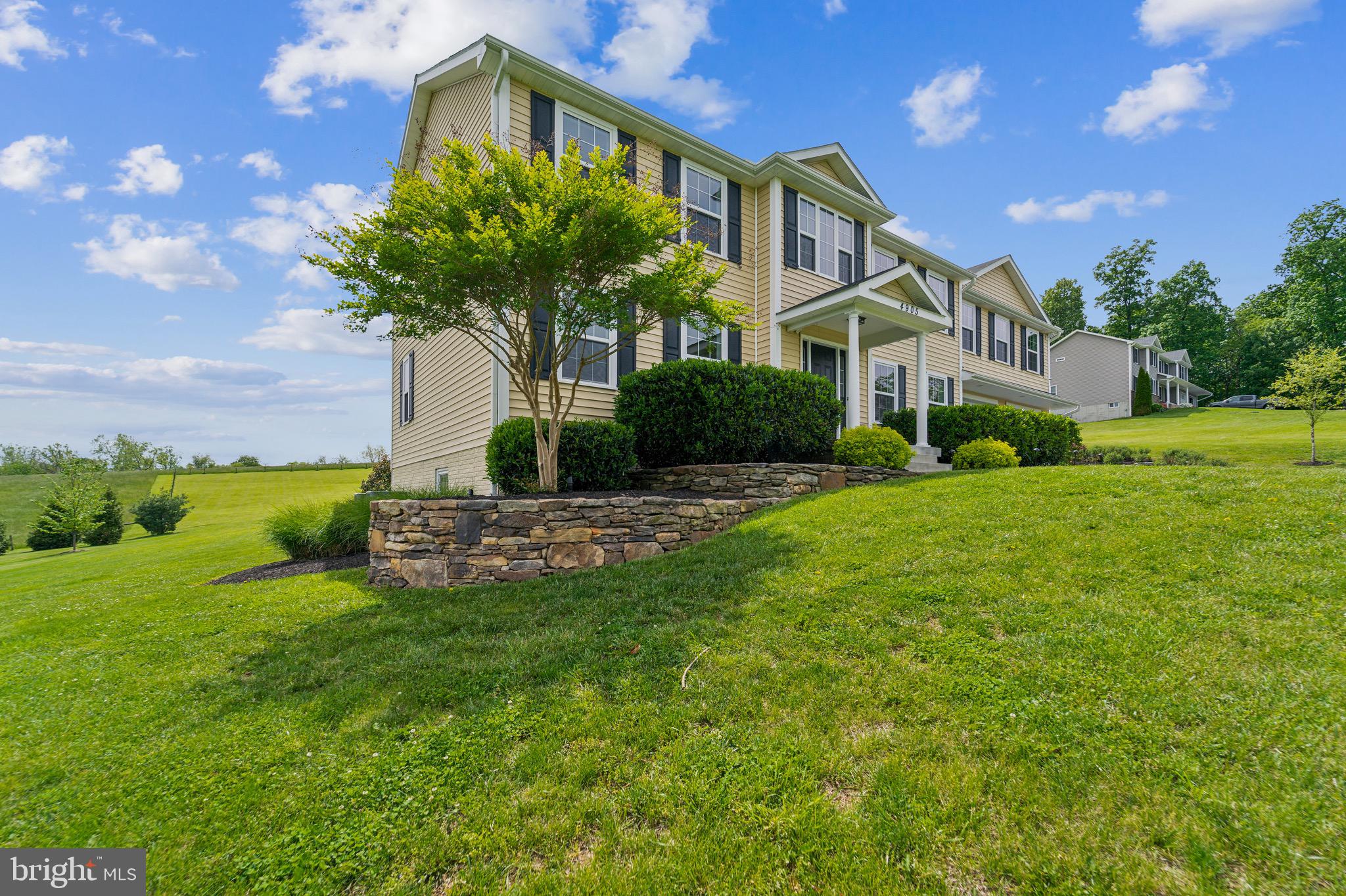 4905 Bartholows Road Mount Airy, MD 21771 - Photo 3 of 70 a front view of a house with garden