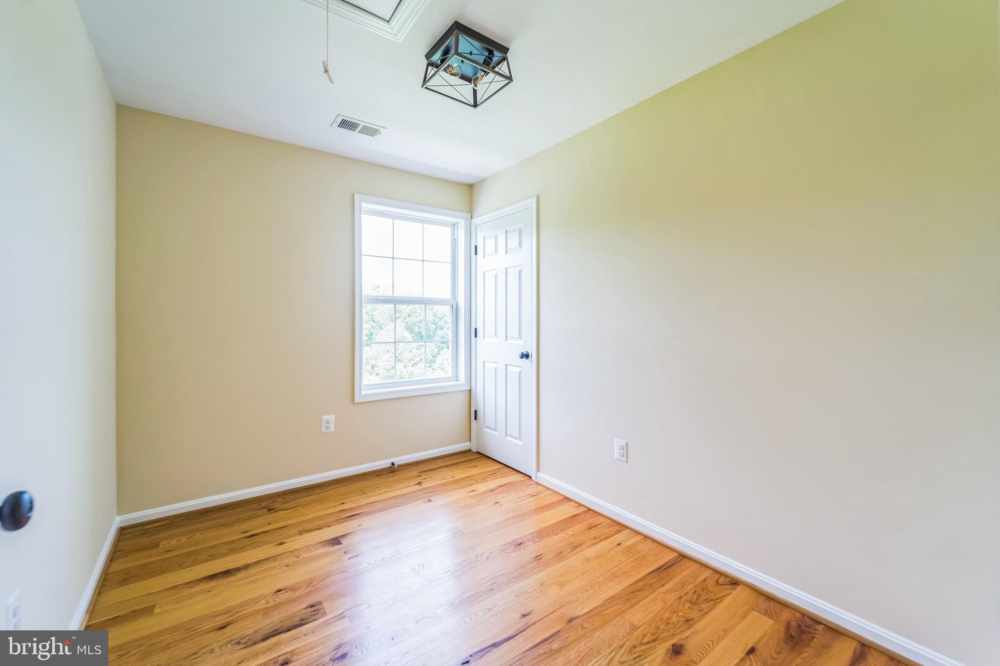 4905 Bartholows Road Mount Airy, MD 21771 - Photo 32 of 70 a view of empty room with wooden floor