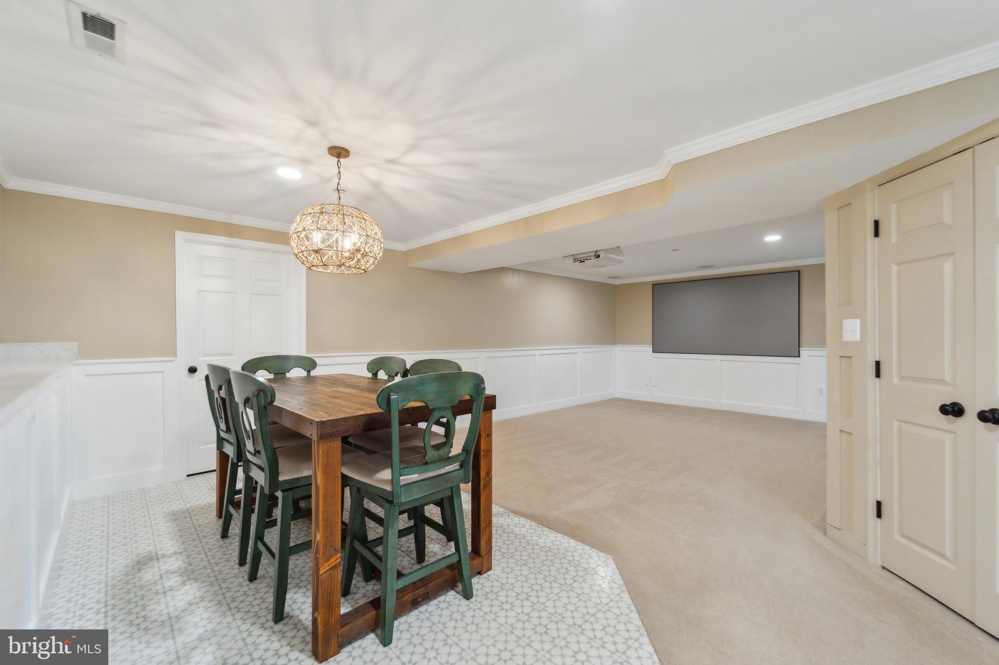 4905 Bartholows Road Mount Airy, MD 21771 - Photo 39 of 70 a view of a dining room with furniture and chandelier