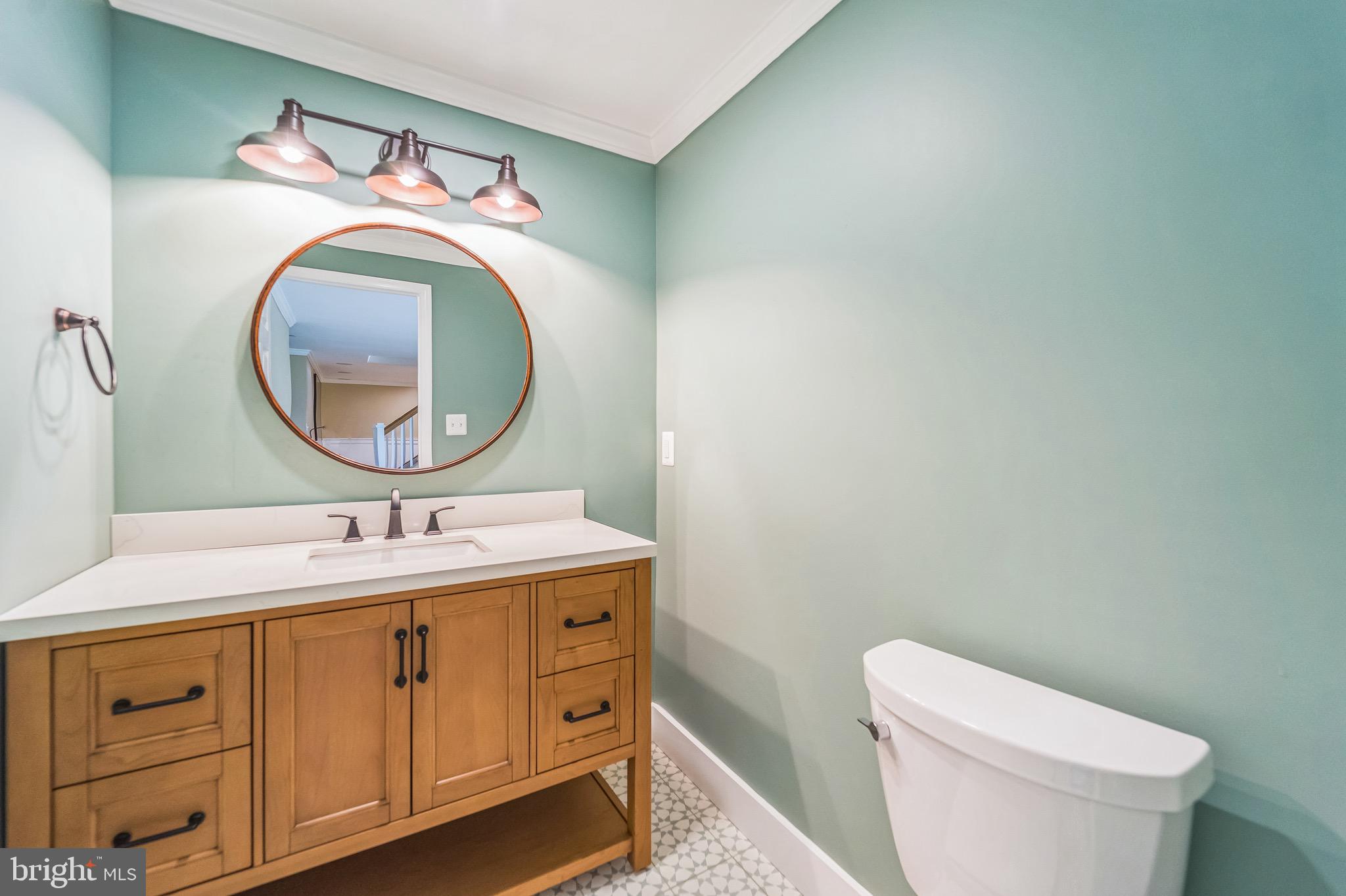 4905 Bartholows Road Mount Airy, MD 21771 - Photo 42 of 70 a bathroom with a toilet sink vanity mirror and vanity