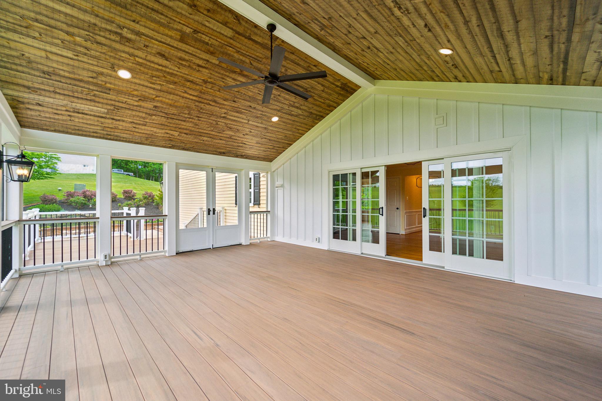 4905 Bartholows Road Mount Airy, MD 21771 - Photo 49 of 70 a view of a deck hardwood flooring and hall with wooden floor