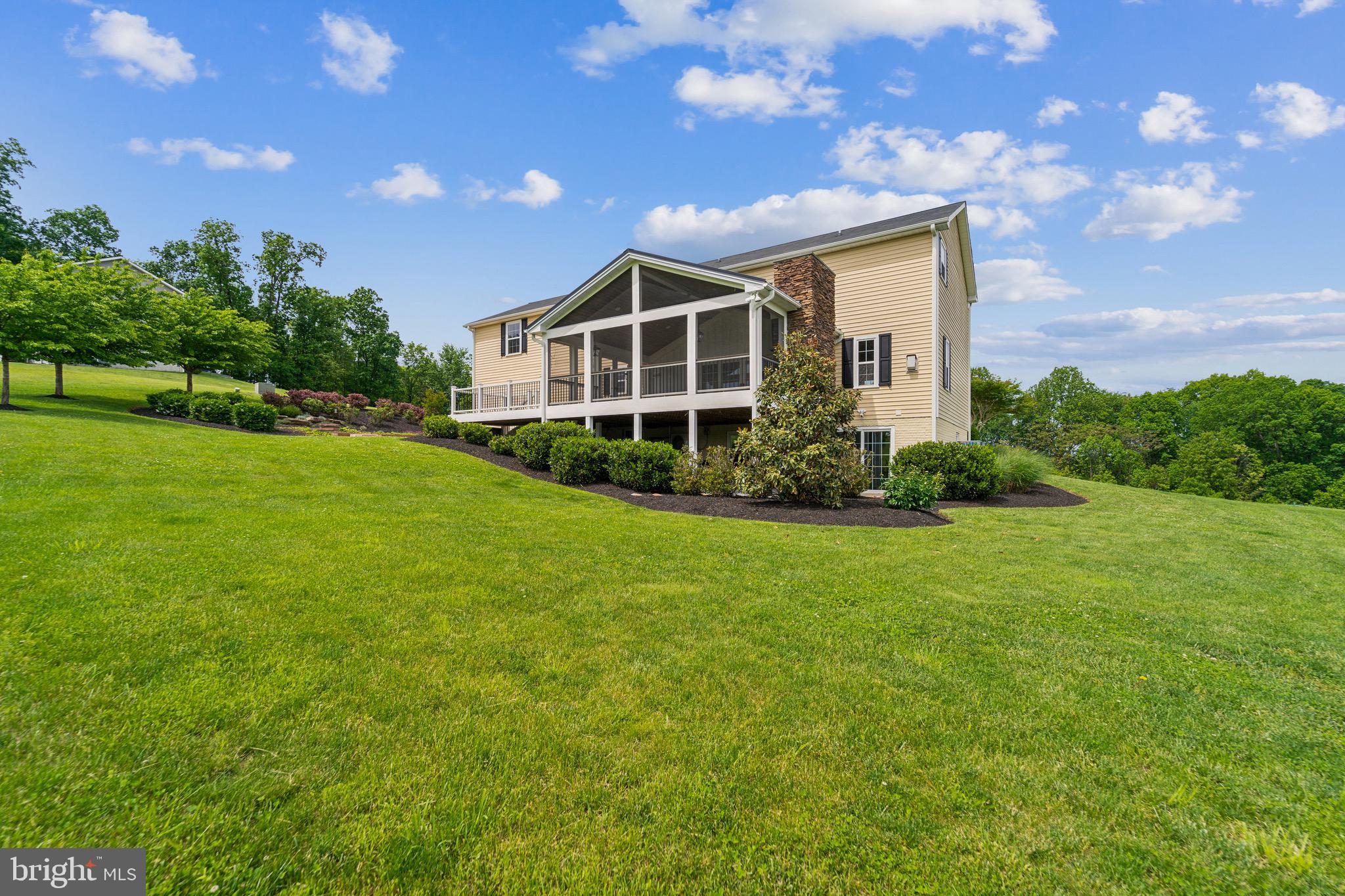 4905 Bartholows Road Mount Airy, MD 21771 - Photo 55 of 70 a front view of a house with garden