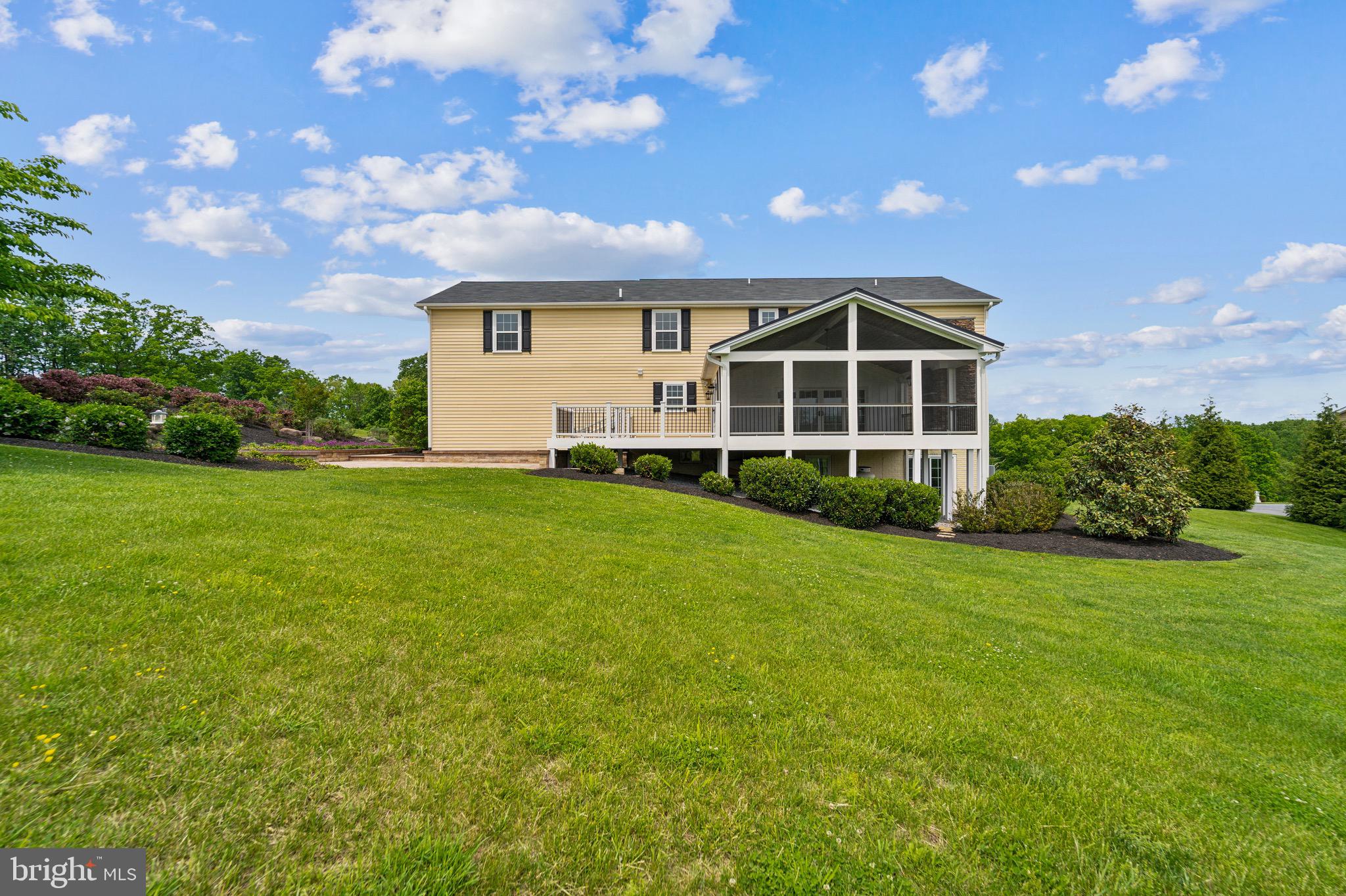 4905 Bartholows Road Mount Airy, MD 21771 - Photo 56 of 70 a front view of a house with a yard