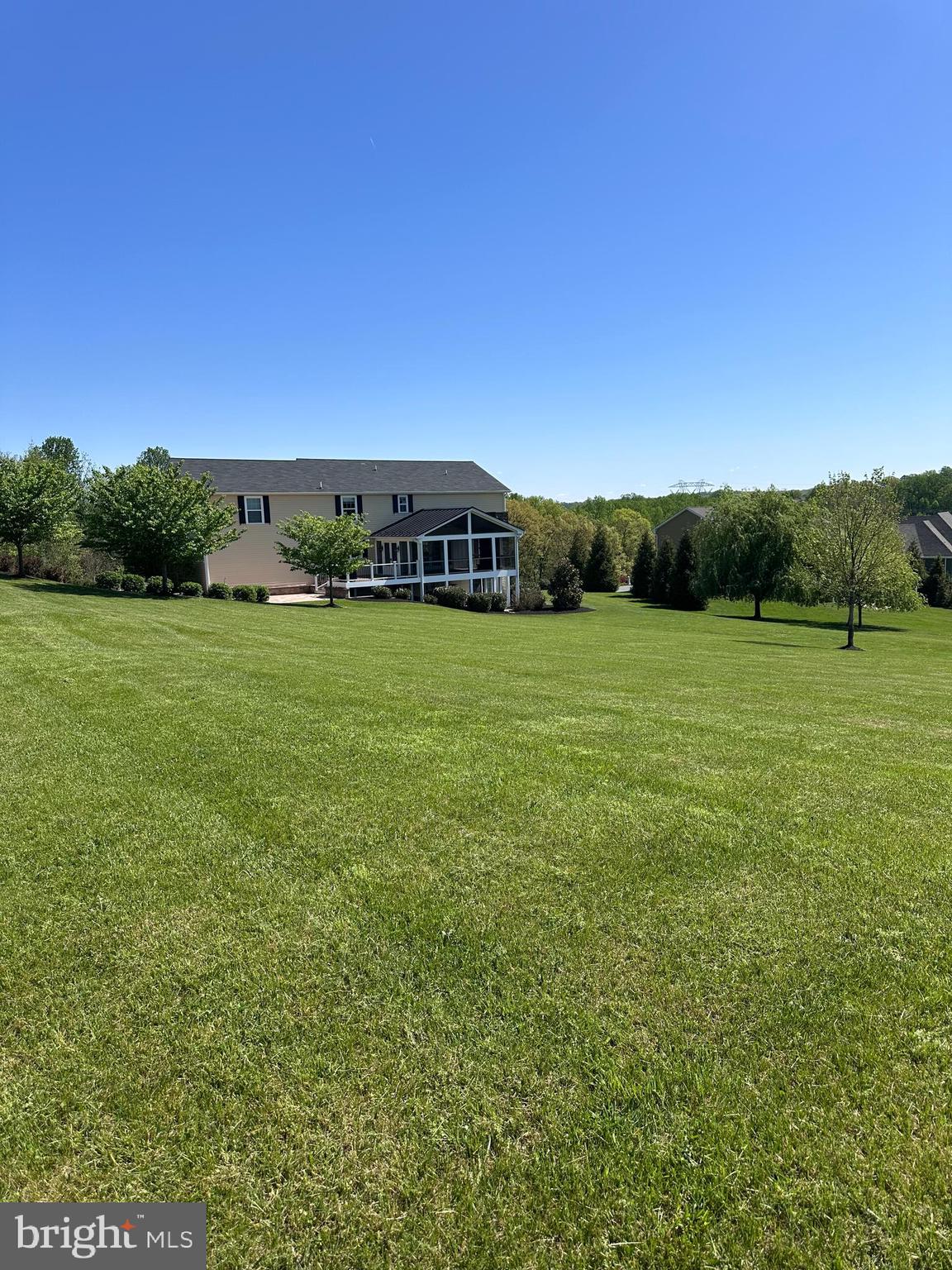 4905 Bartholows Road Mount Airy, MD 21771 - Photo 57 of 70 a view of a grassy field with an trees