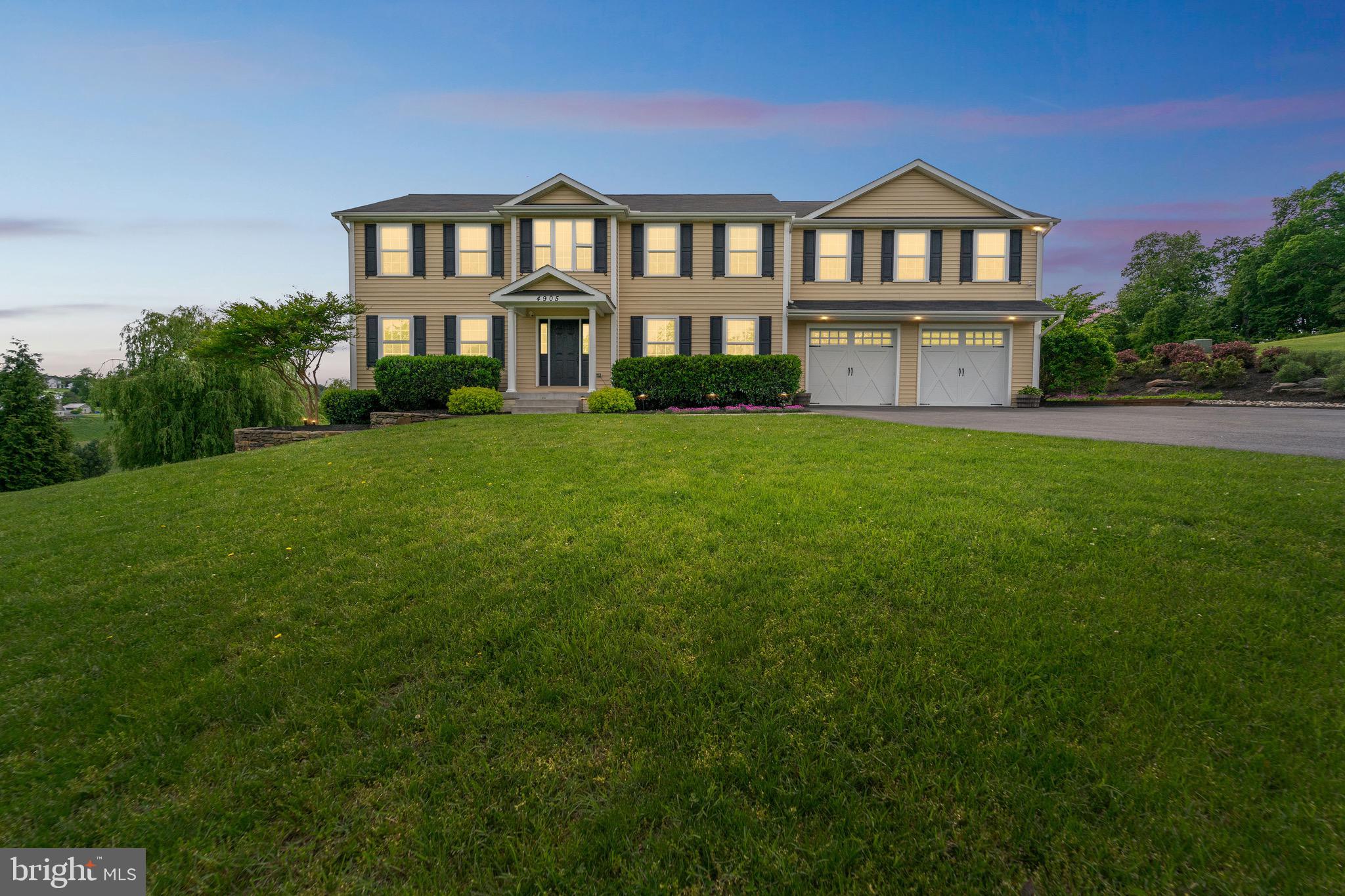 4905 Bartholows Road Mount Airy, MD 21771 - Photo 59 of 70 a front view of a house with a yard and trees