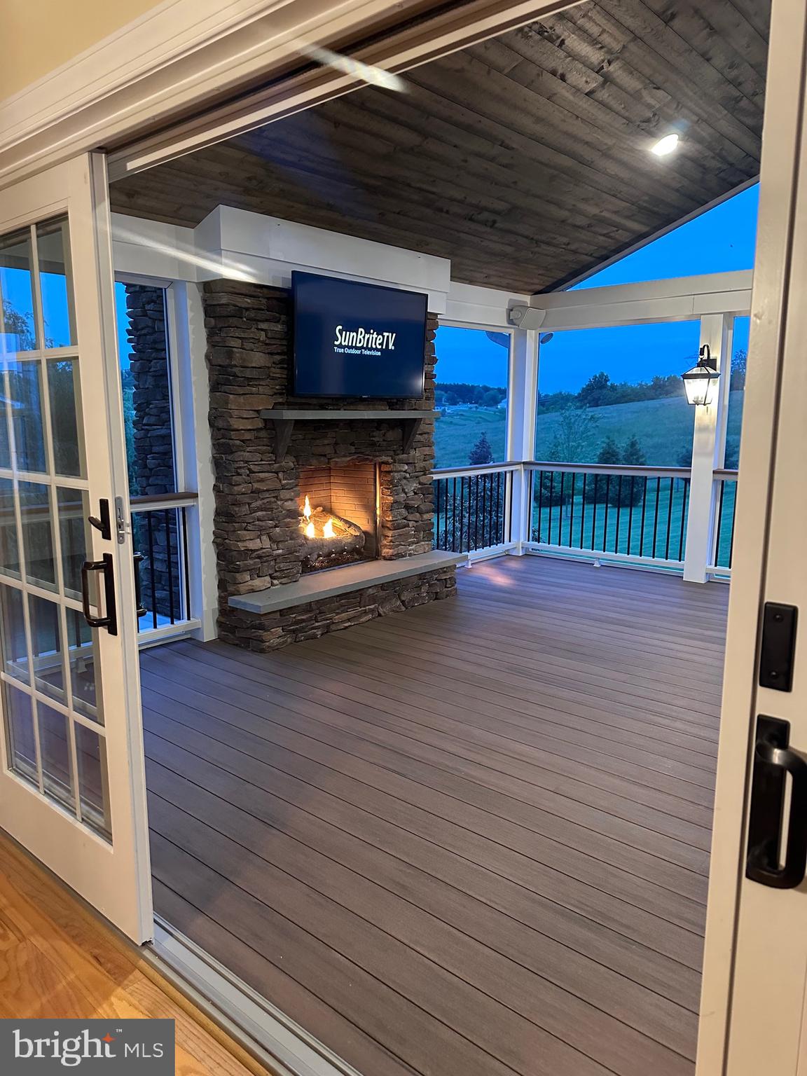 4905 Bartholows Road Mount Airy, MD 21771 - Photo 65 of 70 a view of an empty room with wooden floor and a fireplace