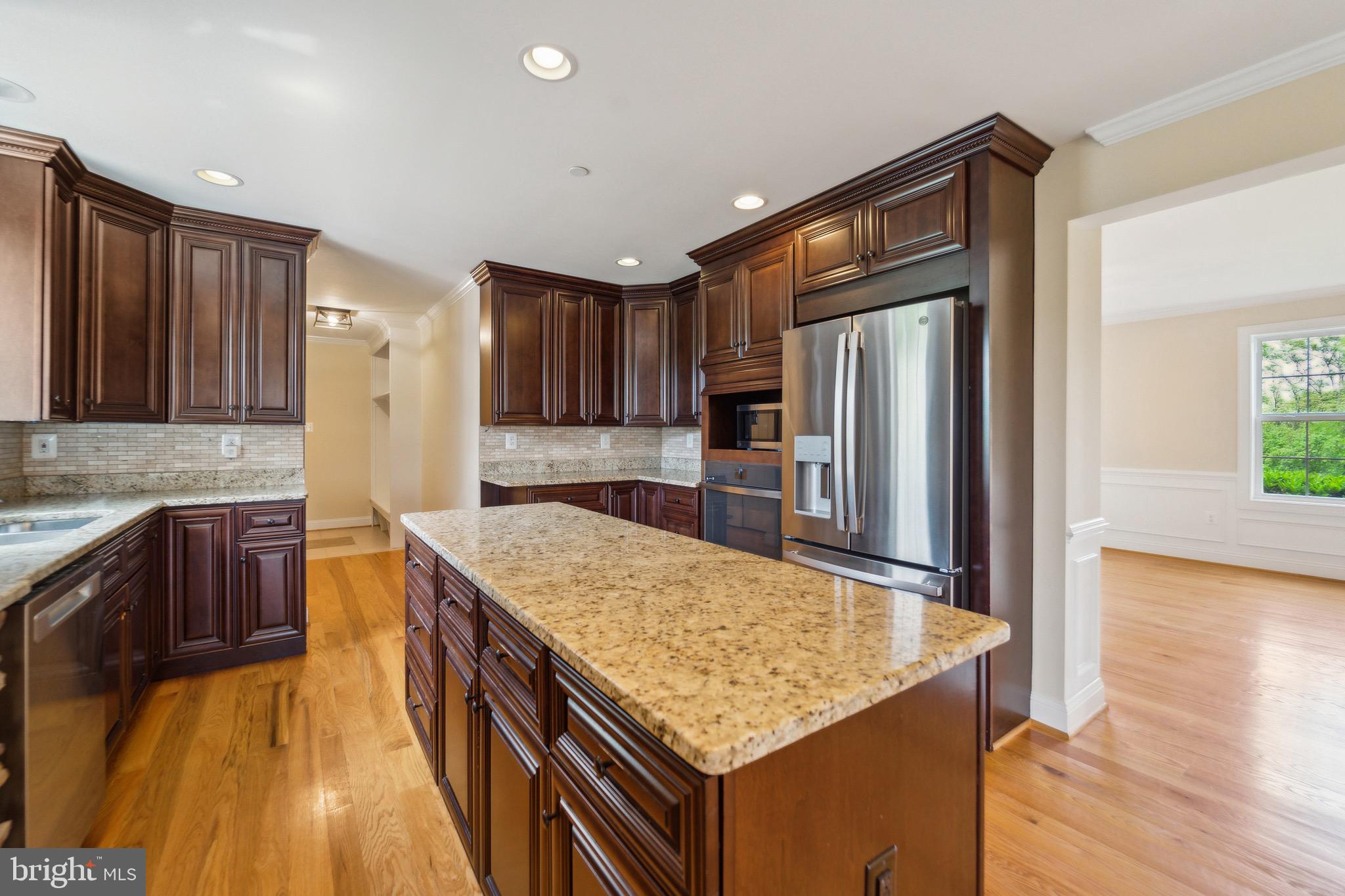 4905 Bartholows Road Mount Airy, MD 21771 - Photo 8 of 70 a kitchen with stainless steel appliances granite countertop a sink refrigerator and cabinets