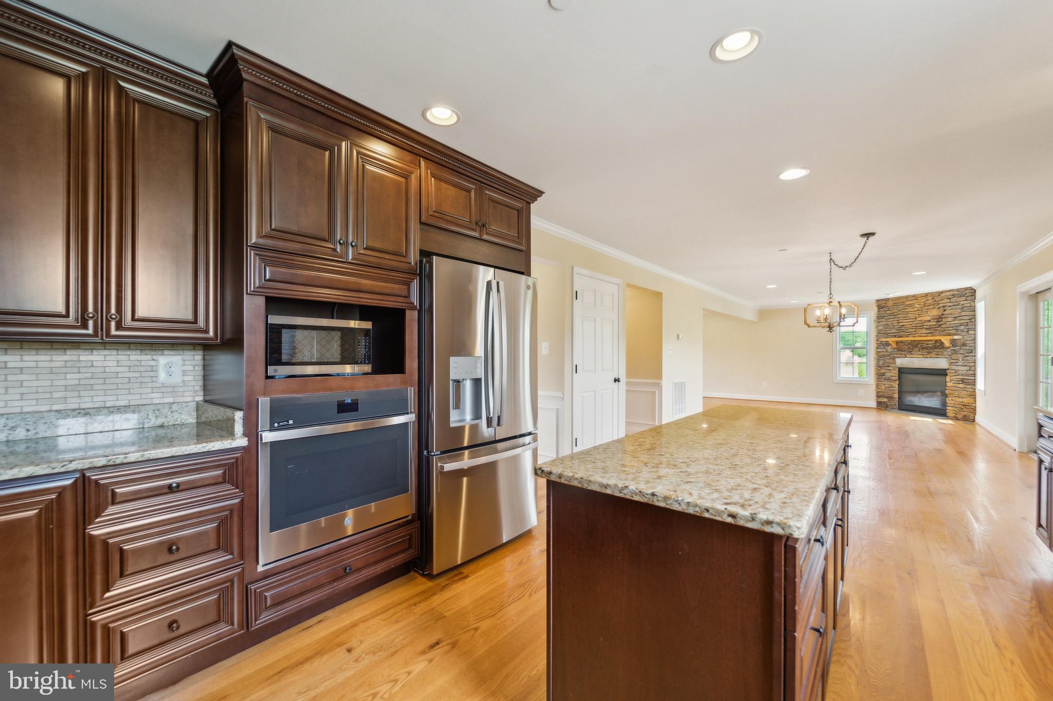 4905 Bartholows Road Mount Airy, MD 21771 - Photo 9 of 70 a kitchen with stainless steel appliances granite countertop a refrigerator and a stove top oven