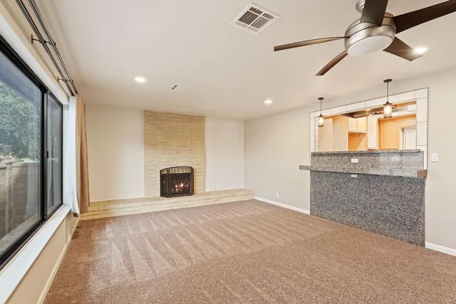 a view of a kitchen with a cabinet and a fireplace