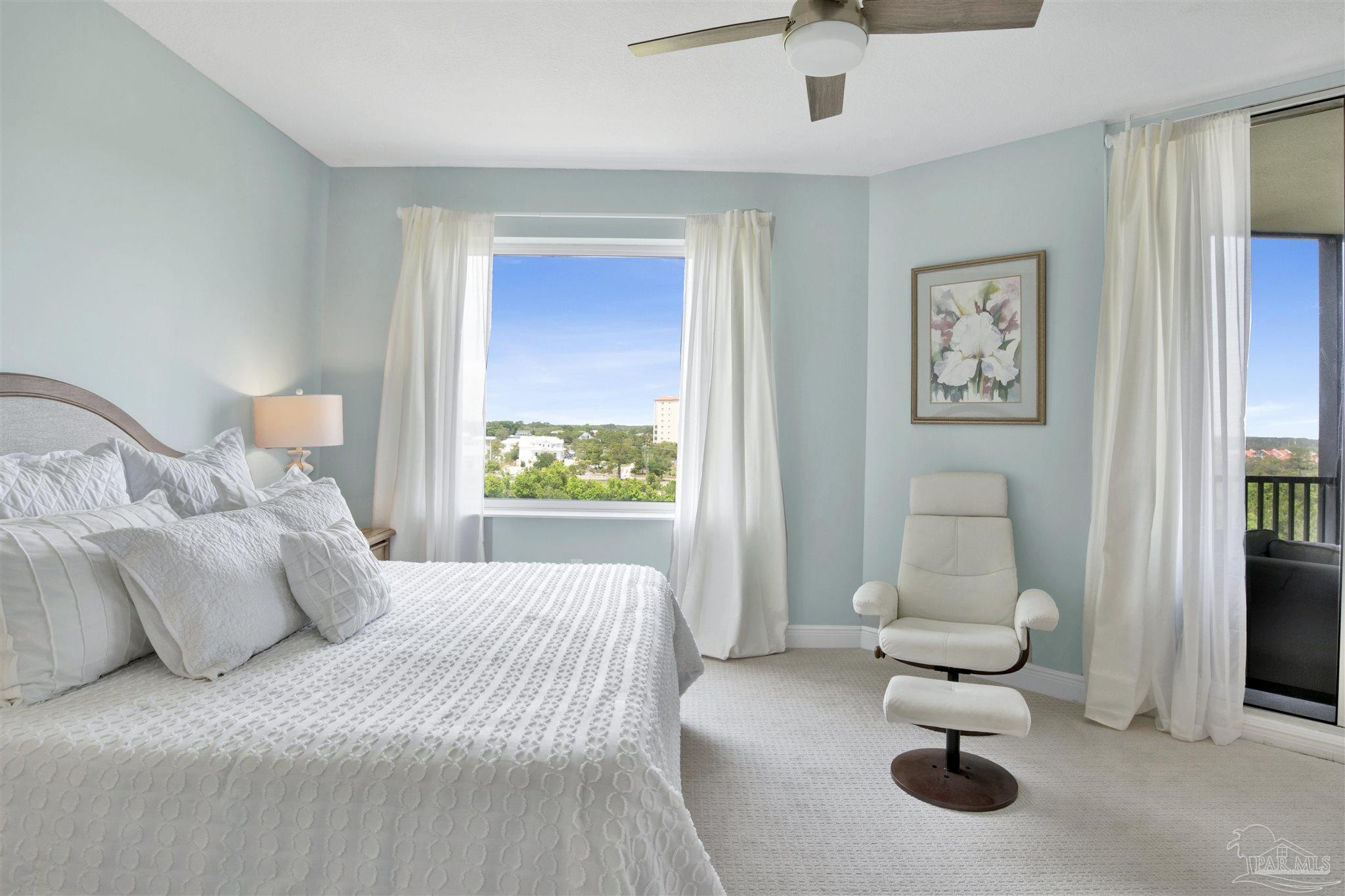 608 Lost Key Drive, Unit 705C Perdido Key, FL 32507 - Photo 19 of 51 a bedroom with a bed and a chandelier