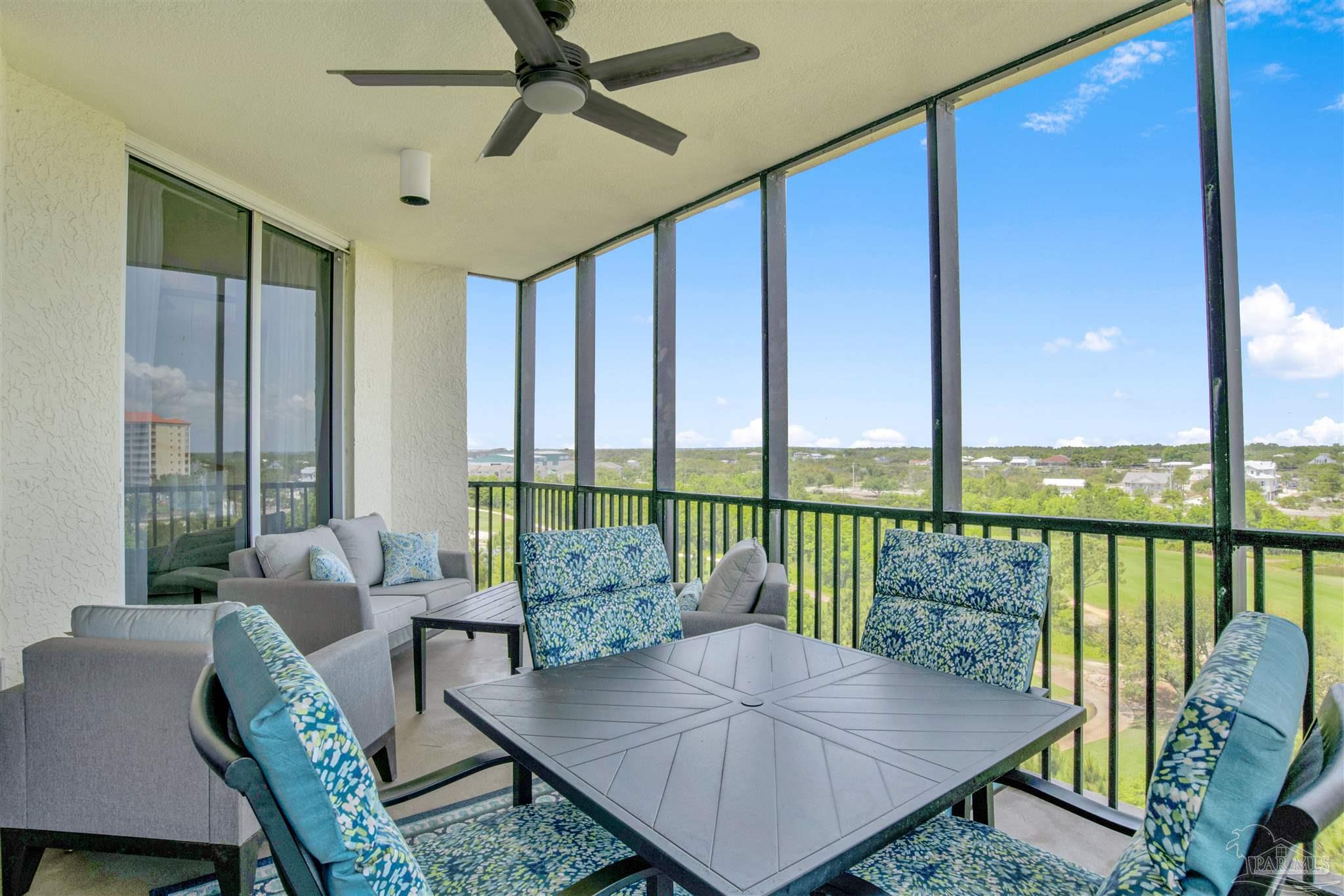 608 Lost Key Drive, Unit 705C Perdido Key, FL 32507 - Photo 2 of 51 a living room with furniture and a floor to ceiling window