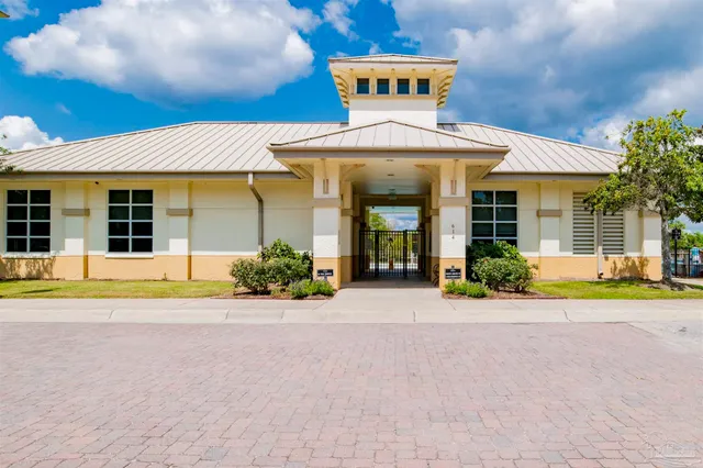 a view of a house with a swimming pool and a yard