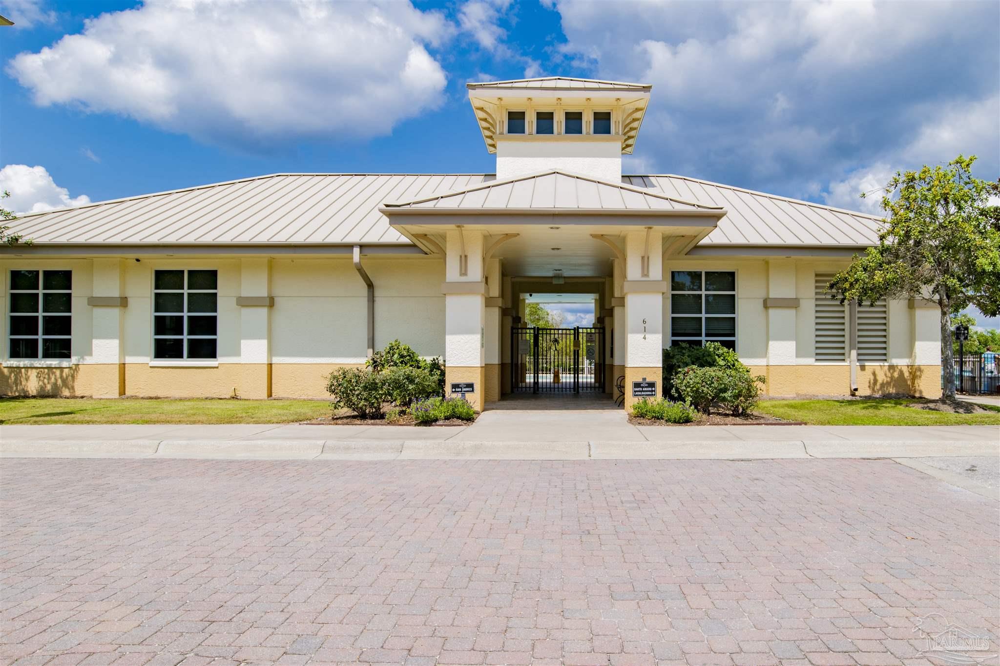 608 Lost Key Drive, Unit 705C Perdido Key, FL 32507 - Photo 35 of 51 a view of a house with a swimming pool and a yard