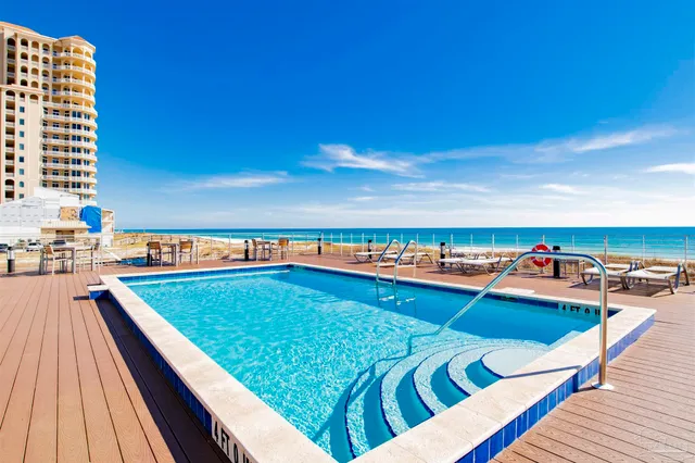 a view of swimming pool with outdoor seating