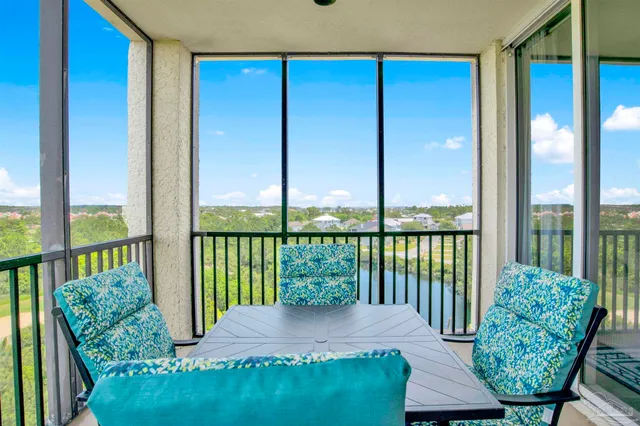 a view of a balcony with furniture