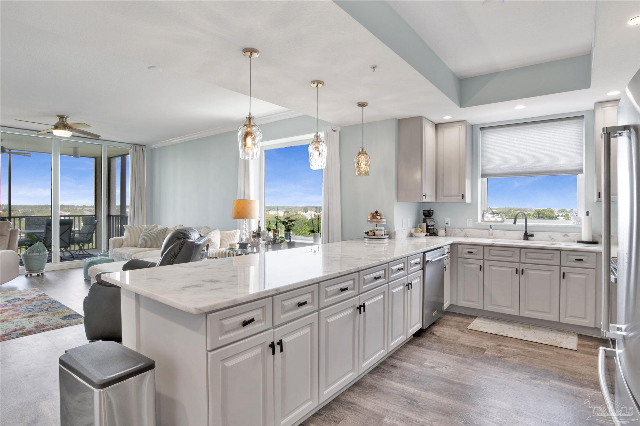 608 Lost Key Drive, Unit 705C Perdido Key, FL 32507 - Photo 5 of 51 a kitchen with sink stove and cabinets