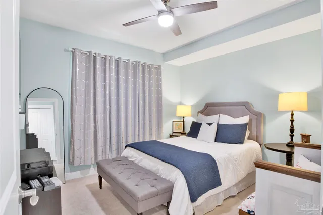 a bedroom with a bed and a lamp