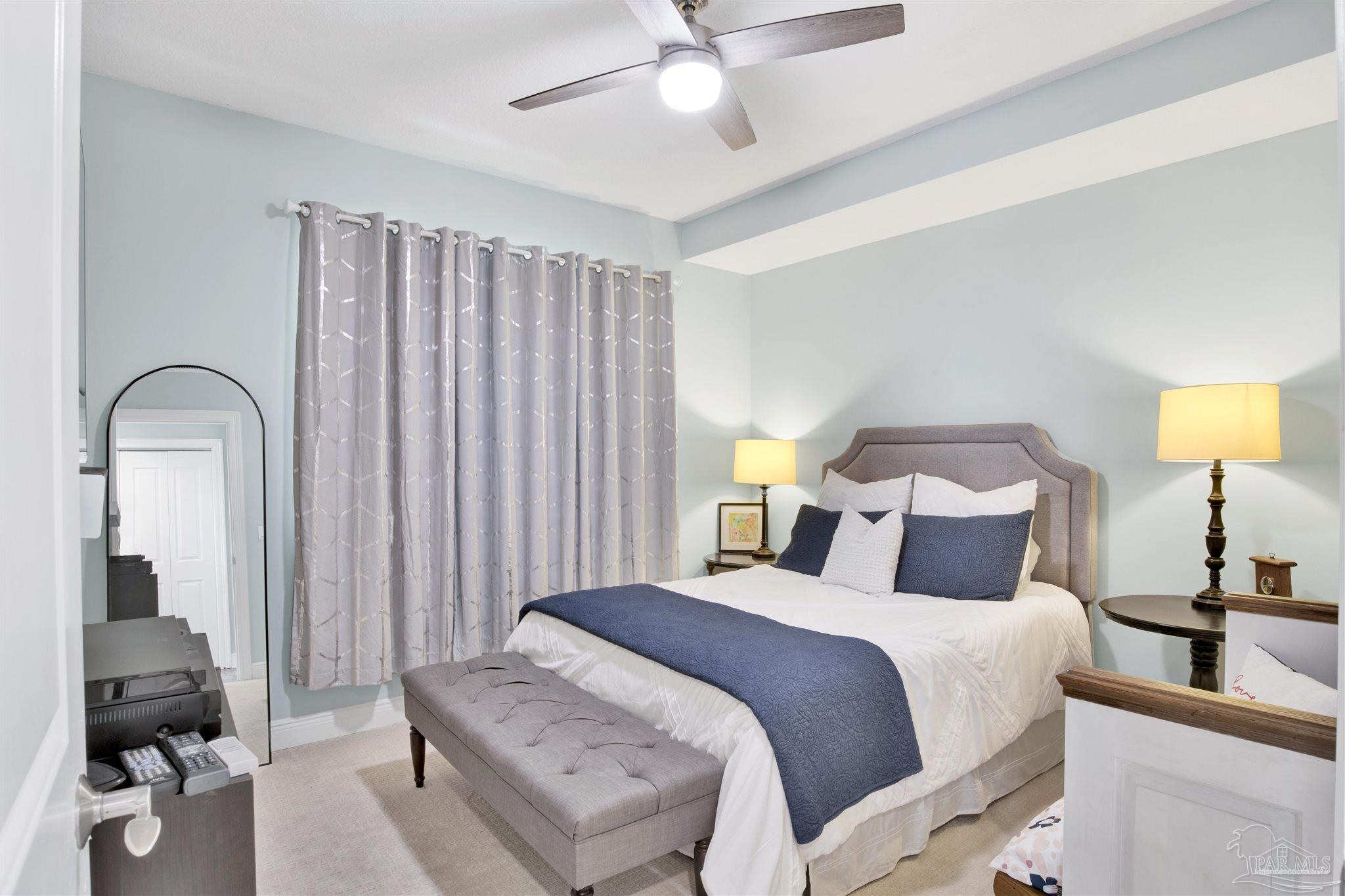 608 Lost Key Drive, Unit 705C Perdido Key, FL 32507 - Photo 9 of 51 a bedroom with a bed and a lamp