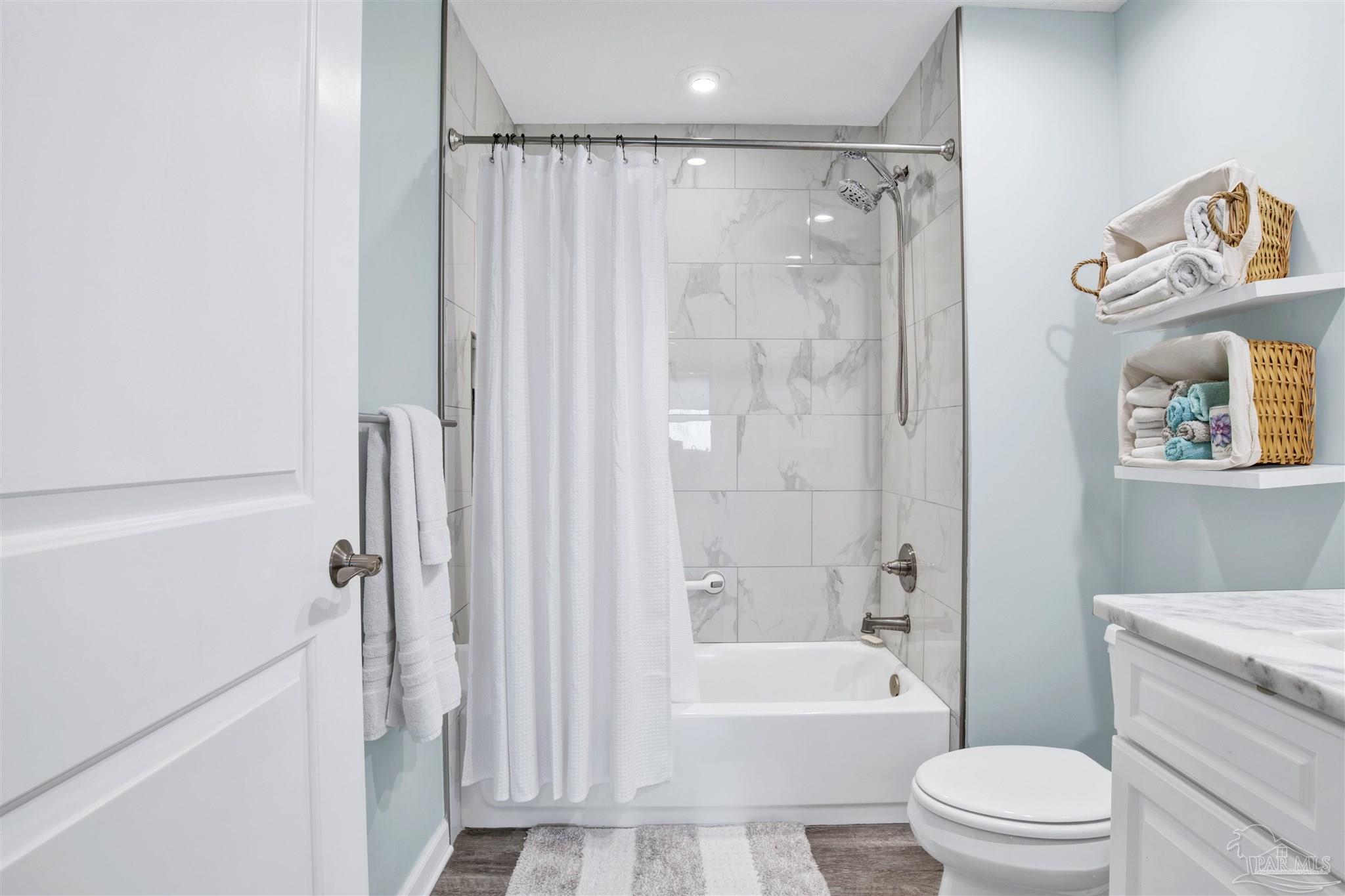 608 Lost Key Drive, Unit 705C Perdido Key, FL 32507 - Photo 10 of 51 a bathroom with a shower a toilet and a bathtub