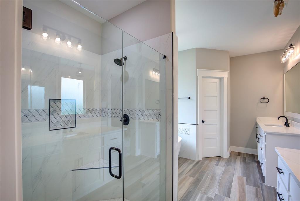 405 Door Key Ranch Road Trinidad, TX 75163 - Photo 21 of 28 Bathroom with a shower with door, vanity, and hardwood / wood-style floors