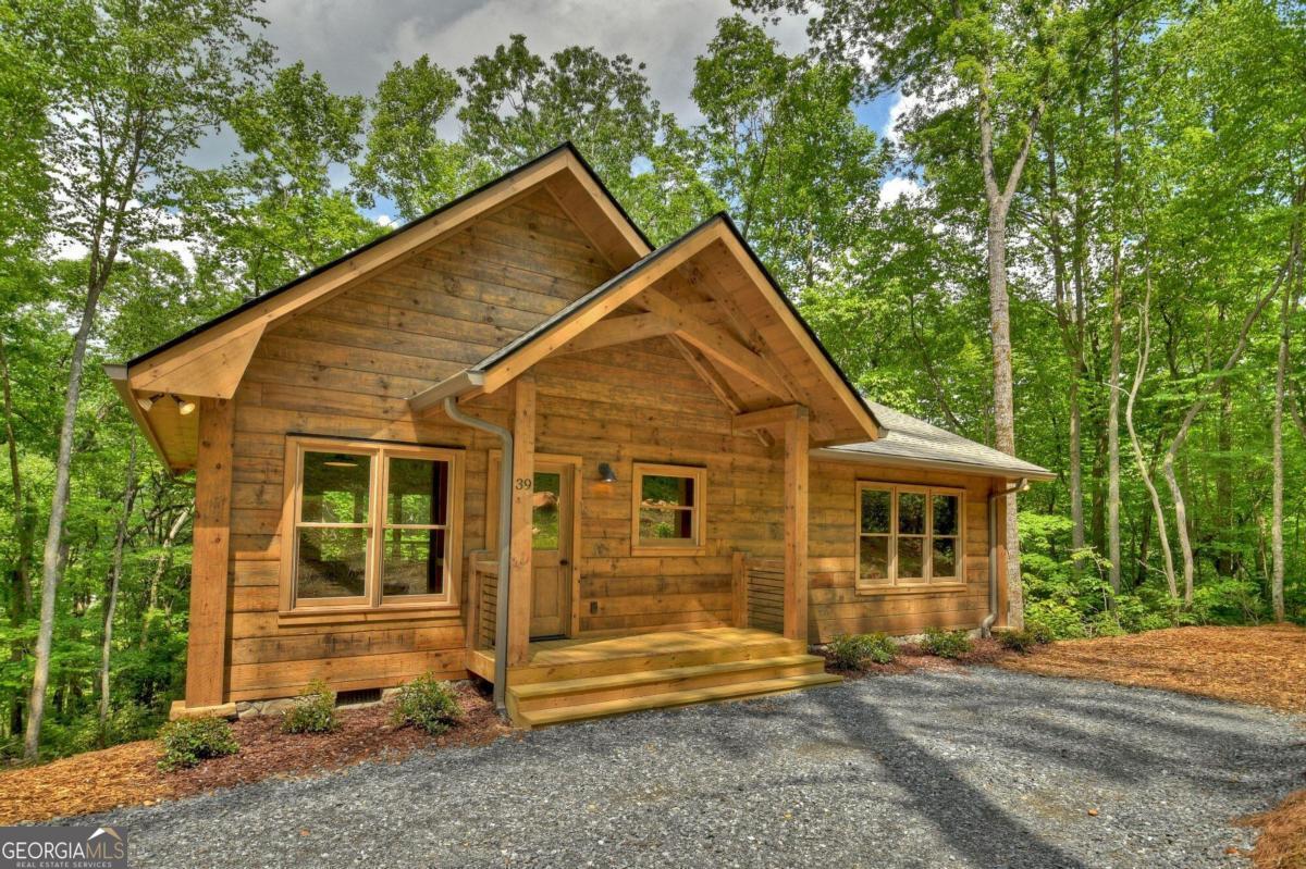 261 Jones Creek Road Ellijay, GA 30540 - Photo 1 of 1 a view of a house with a yard