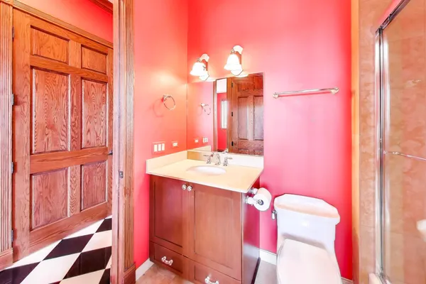 a bathroom with a sink a mirror and a shower