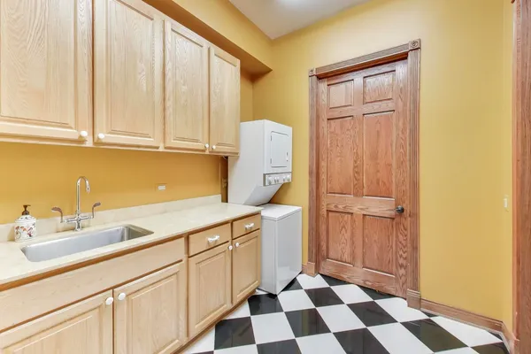 a kitchen with a refrigerator and cabinets