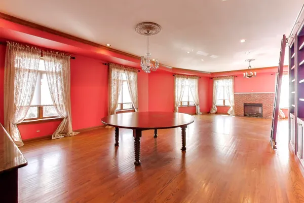 a view of a room with furniture window and wooden floor