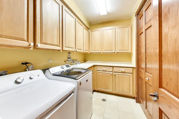 a kitchen with a sink and a refrigerator